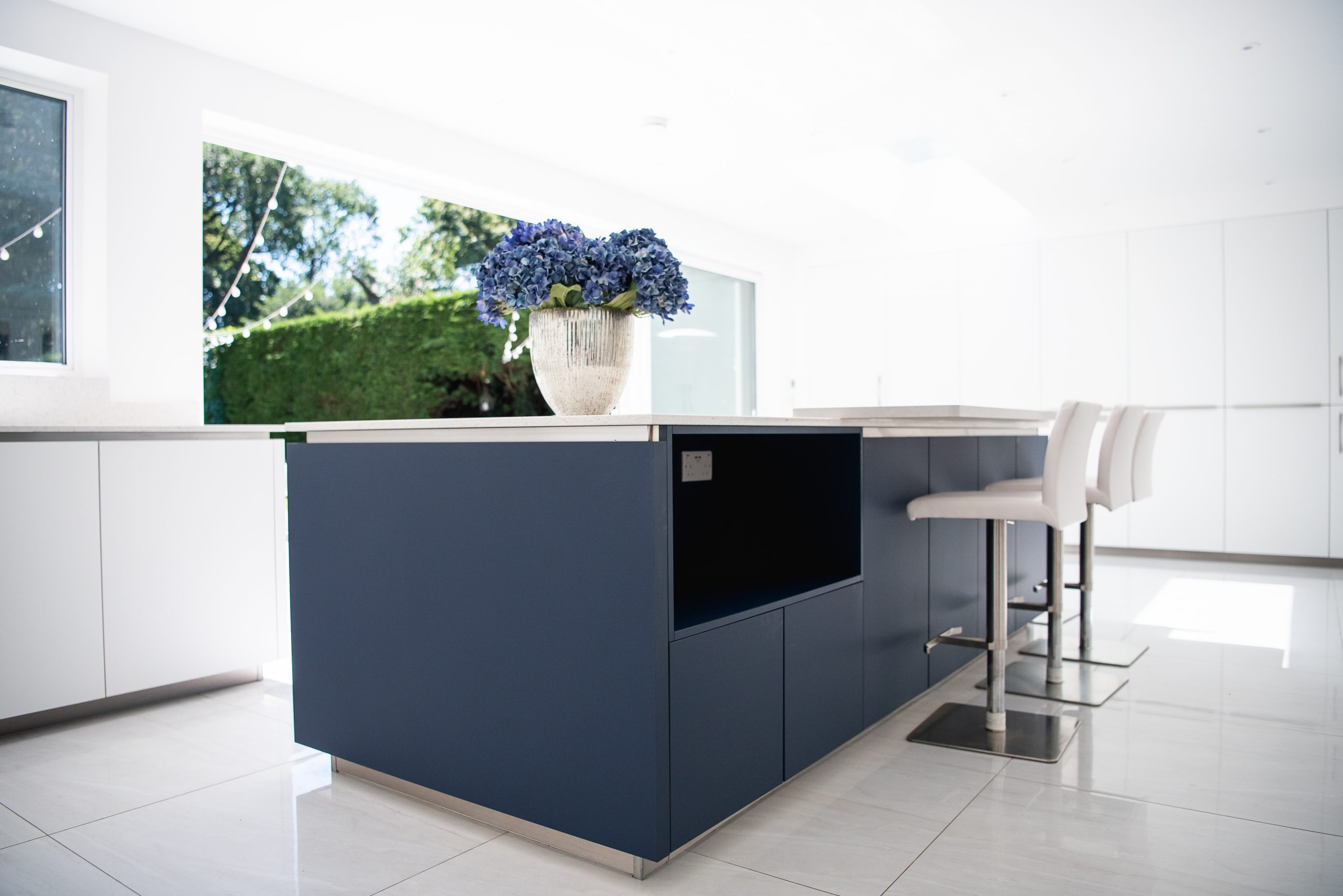 Large blue kitchen island with breakfast bar